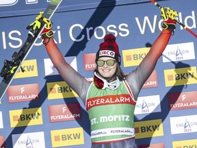 Winner Marielle Thompson, of Canada, celebrates on the podium after the Ski Cross World Cup race in St. Moritz, Switzerland, Sunday Jan. 28, 2024.