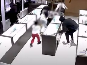 Video footage shows a smash-and-grab jewelry heist.