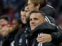 With the Florida half of training camp nearing a close, Toronto FC opens its pre-season schedule Friday with a game against Nashville SC. Toronto FC's incoming head coach John Herdman is embraced as they sing the national anthem prior to first half MLS soccer action against the Orlando City, in Toronto, Saturday, Oct. 21, 2023.
