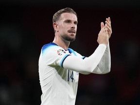 FILE - England's Jordan Henderson applauds at the end of the Euro 2024 group C qualifying soccer match between England and Italy at Wembley stadium in London, Tuesday, Oct. 17, 2023. England international Jordan Henderson has arrived in Amsterdam amid reports he was about to sign a deal with struggling Dutch powerhouse Ajax to end his six-month spell in the Saudi Pro League.