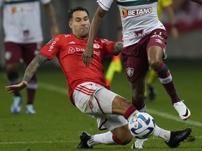 Hugo Mallo of Brazil's Internacional battles for the ball during a Copa Libertadores semifinal second leg soccer match at Beira Rio stadium in Porto Alegre, Brazil, Wednesday, Oct. 4, 2023. Soccer player Hugo Mallo will go on trial on an accusation he inappropriately touched a mascot before a Spanish league game in 2019, court officials said Wednesday. Mallo, who denies wrongdoing, was with Celta Vigo when the alleged incident happened before a first-division match against Espanyol. The 32-year-old Spanish player currently plays for Brazilian club Internacional.