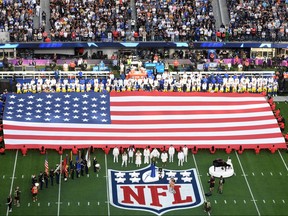 U.S. country singer Mickey Guyton sings the National Anthem ahead of Super Bowl LVI between the Los Angeles Rams and the Cincinnati Bengals at SoFi Stadium in Inglewood, Calif., on Feb. 13, 2022.