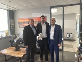 Michael Levy (centre) brought his nephew’s teddy bear and his story to Canada Christian College to help his brother, the boy’s father, gain his release from Hamas’ captivity in Gaza. Also pictured are college president Dr. Charles McVety and lawyer Joel Etienne. — supplied