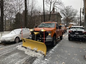 A plow clears snow and slush