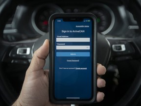 The ArriveCAN app is pictured on the screen of a cellphone in this file photo.