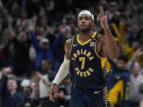 Indiana Pacers' Buddy Hield reacts after hitting a three-point shot.