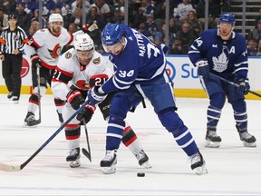 Mathieu Joseph of the Ottawa Senators battles against Auston Matthews of the Toronto Maple Leafs earlier this season.