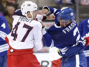 Toronto Maple Leafs' Mark Fraser fights with Dalton Prout of Columbus during a game in 2013.