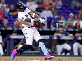 Jorge Soler of the Miami Marlins hits a two-run home run against the Toronto Blue Jays.