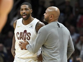 Cleveland Cavaliers' Tristan Thompson, left, is held back by head coach J.B. Bickerstaff, after Thompson was called for a technical foul.