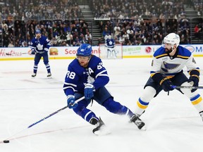 Toronto Maple Leafs forward William Nylander protects the puck from St. Louis Blues defenceman Nick Leddy.