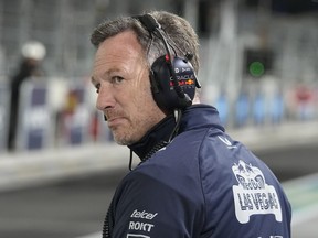 Christian Horner, team principal of Red Bull, looks down pit lane during the first practice session for the Formula One Las Vegas Grand Prix.