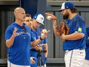 Toronto Blue Jays pitching coach Pete Walker talks with Alek Manoah in a throwing session during Spring Training.