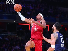 Shai Gilgeous-Alexander of the Oklahoma City Thunder and Western Conference All-Stars drives to the basket.