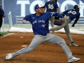 Toronto Blue Jays pitcher Yariel Rodriguez throws during a spring training workout.