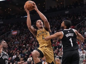 Toronto Raptors' Scottie Barnes shoots on Brooklyn Nets forward Mikal Bridges.