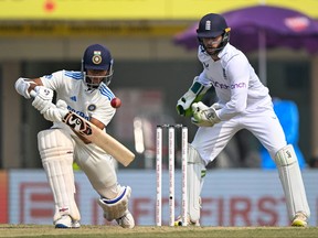 India's Yashasvi Jaiswal (L) plays a shot during the fourth day of the fourth Test cricket match between India and England.