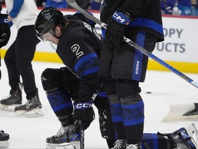 Toronto Maple Leafs defenceman Simon Benoit struggles to leave the ice after suffering an injury.
