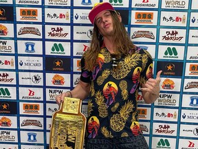 Matt Riddle poses with the NJPW TV championship.