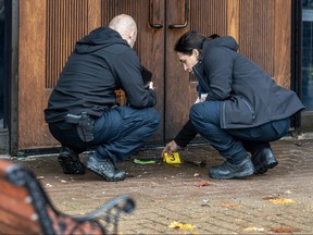 Police investigate an apparent firebombing at the Congregation Beth Tikvah and at the rear of the nearby CJA building in Dollard-des-Ormeaux on Tuesday Nov. 7, 2023.