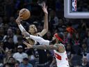 Victor Wembanyama, left, of the San Antonio Spurs blocks a shot by Gary Trent Jr. of the Toronto Raptors in the first half at Frost Bank Center on Nov.  5, 2023, in San Antonio, Texas.