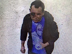 A handout CCTV grab released by Britain's Metropolitan Police in London on February 1, 2024 shows Abdul Shokoor Ezedi, taken in a Tesco store in north London late on January 31, 2024, which appears to show severe damage to his face. (Photo by Metropolitan Police / AFP)