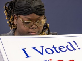A woman casts her ballot