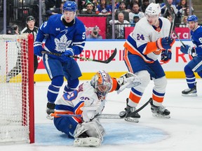 Ilya Sorokin of the New York Islanders makes a stick save against the Toronto Maple Leafs.