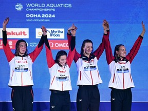 Bronze medalists, Rebecca Smith, Sarah Fournier, Katerine Savard and Taylor Ruck of Team Canada pose with their medals during the Medal Ceremony after the Women's 4x100m Freestyle Final on day ten of the Doha 2024 World Aquatics Championships at Aspire Dome on Feb. 11, 2024 in Doha, Qatar.