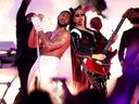 Usher, left, and H.E.R. perform onstage during the Apple Music Super Bowl LVIII Halftime Show at Allegiant Stadium on Sunday, Feb. 11, 2024, in Las Vegas, Nev.