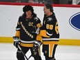 Sidney Crosby, left, of the Pittsburgh Penguins shares a laugh with Jaromir Jagr during warm-ups before the game between the Pittsburgh Penguins and the Los Angeles Kings on Feb. 18, 2024.
