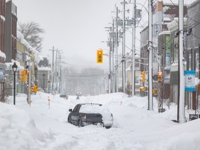 A truck is abandoned on a snow-covered street after a winter storm in Sydney, N.S. on Monday, Feb.5, 2024.