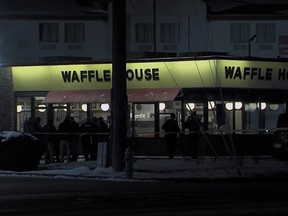 This screen shot from video provided by WRTV shows law enforcement outside of a Waffle House restaurant in Indianapolis early Monday, Feb. 19, 2024, where at least one person was killed and several injured.