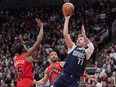 Luka Doncic of the Dallas Mavericks puts up a shot.