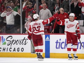 Patrick Kane #88 of the Detroit Red Wings celebrates scoring the game winning goal with Alex DeBrincat #93 during overtime against the Chicago Blackhawks at the United Center on February 25, 2024 in Chicago, Illinois. (Photo by Patrick McDermott/Getty Images)