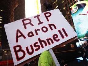 A person holds a sign during a vigil for U.S. Airman Aaron Bushnell at the US Army Recruiting Office in Times Square on February 27, 2024 in New York City. Bushnell died after setting himself on fire outside the Israeli Embassy in Washington, DC on Sunday. (Photo by Michael M. Santiago/Getty Images)