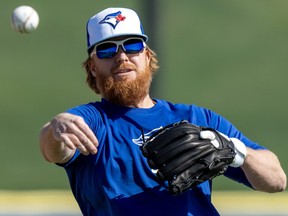 Toronto Blue Jays Justin Turner throws a ball in a drill during Spring Training action in Dunedin, Fla. on Monday February 19, 2024. THE CANADIAN PRESS/Frank Gunn