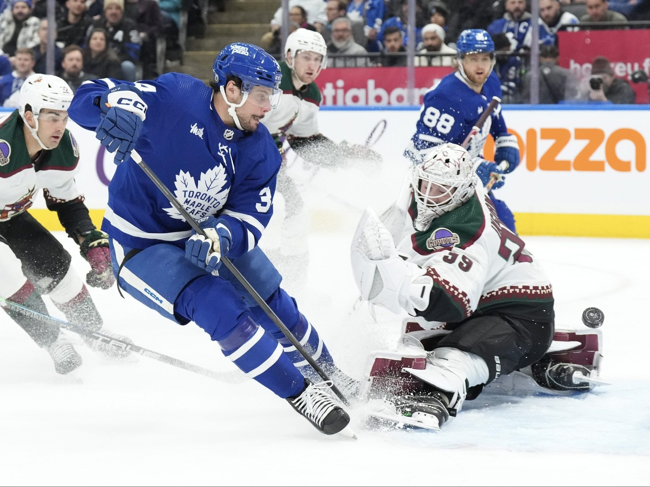 Woll and Maple Leafs hang on to beat Coyote curse