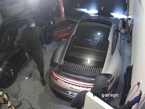 Thieves are caught on surveillance video stealing luxury vehicles.