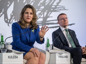 Deputy Prime Minister and Minister of Finance Chrystia Freeland, left, and Latvia's President Edgars Rinkevics attend the Ukranian Breakfast on the sideline of the World Economic Forum (WEF) meeting in Davos on Jan. 18, 2024.