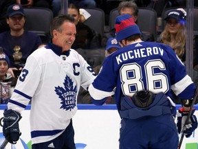 Nikita Kucherov, right, of the Lightning high fives former Maple Leaf Doug Gilmour after competing in the Cheetos NHL Accuracy Shooting during 2024 NHL All-Star Skills competition at Scotiabank Arena in Toronto, Friday, Feb. 2, 2024.