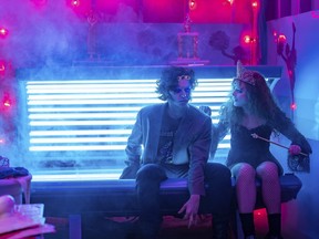 This image released by Focus Features shows Kathryn Newton, right, and Cole Sprouse in a scene from "Lisa Frankenstein."