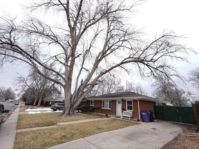The residence where a former funeral home owner kept a deceased women's body in a hearse for two years as well as the remains of 30 cremated people is shown Friday, Feb. 16, 2024, in southwest Denver.