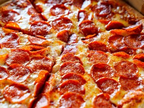 Closeup of pepperoni pizza out of the box