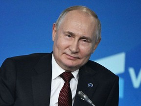 Russian President Vladimir Putin attending the plenary session of the Valdai Discussion Club forum in Sochi on October 5, 2023.