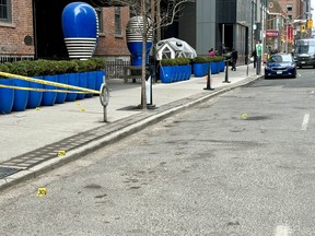 Toronto Police at the scene of a shooting on Blue Jays Way on Tuesday, Feb. 27, 2024. CYNTHIA MCLEOD/TORONTO SUN