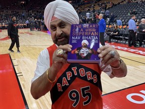 "Superfan" Nav Bhatia shows off his new book.