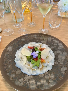 Scallop carpaccio with truffle and a glass of Veuve Clicquot Vintage 2002 Magnum during a private lunch and tasting at Manoir de Verzy