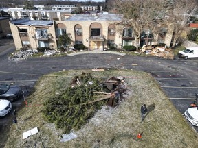 An apartment complex shows roof and structure damage following overnight storms in Mundelein, Ill., Wednesday, Feb. 28, 2024.