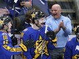 Jim Montgomery, right, head coach of the Bruins and behind the bench for Team Matthews, celebrates a goal along with Mathew Barzal, left, of the Islanders and Filip Forsberg, centre, of the Predators during the 2024 NHL All-Star Game in Toronto, Saturday, Feb. 3, 2024.